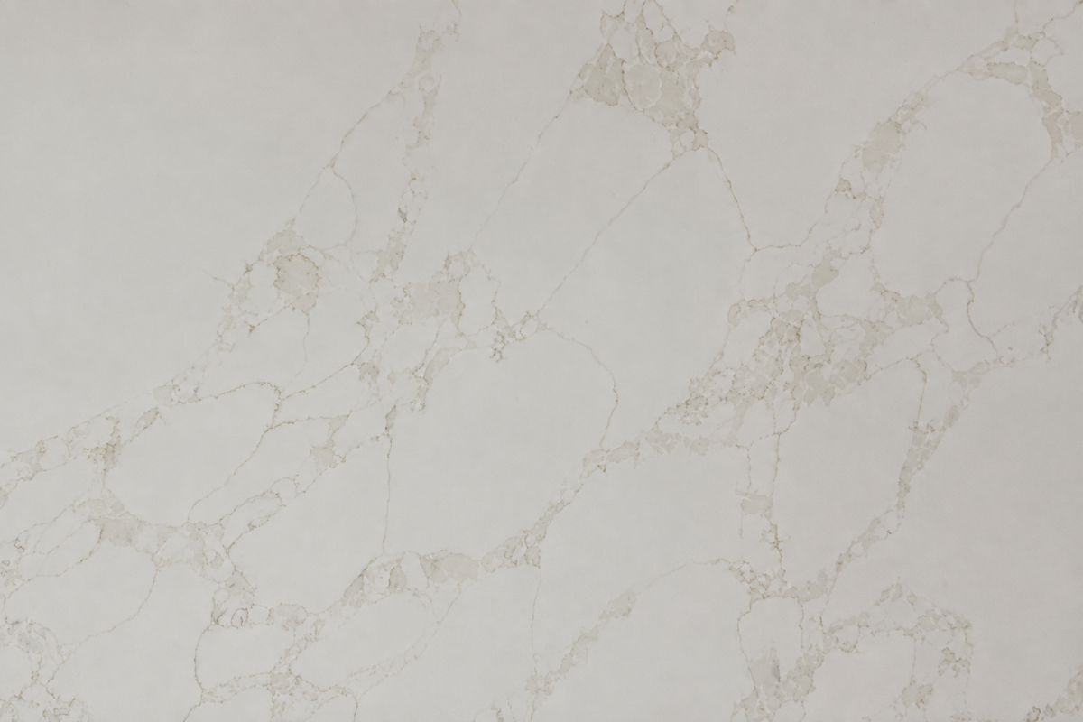 Close-up of Calacatta Eterna Quartz showing soft beige veining and subtle natural stone movement