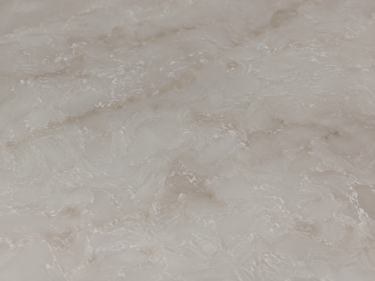 Close-up of Taj Mahal Gold Quartz showing its polished cloudy crystalline texture and faint beige accents