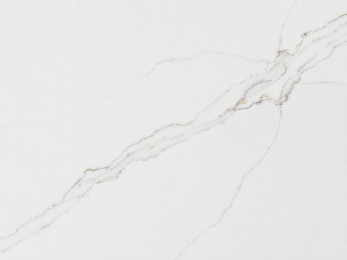 Close-up of Calacatta Alba Quartz showing elegant gold and soft gray veining on a white surface