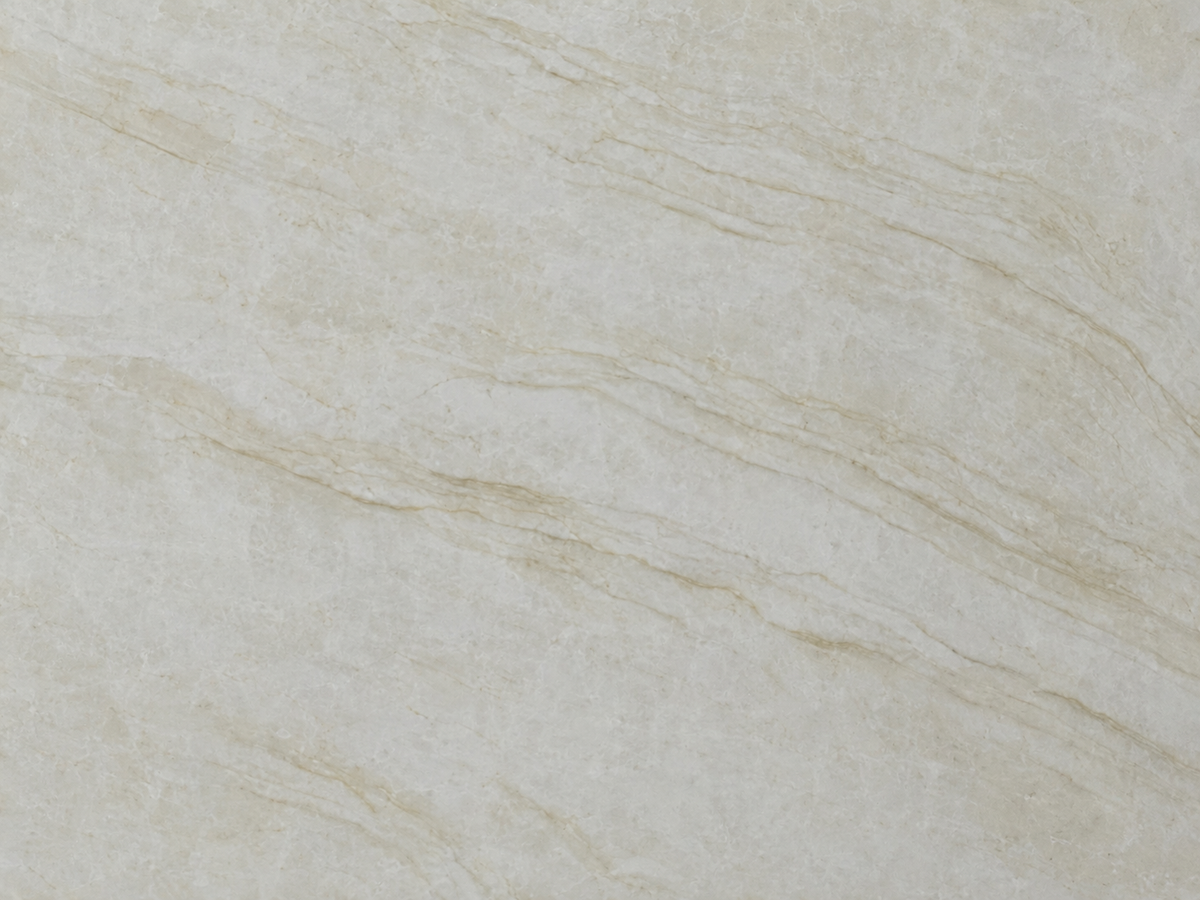 Close-up of Printed Taj Mahal Quartz showing soft beige and cream layered veining across a warm white surface