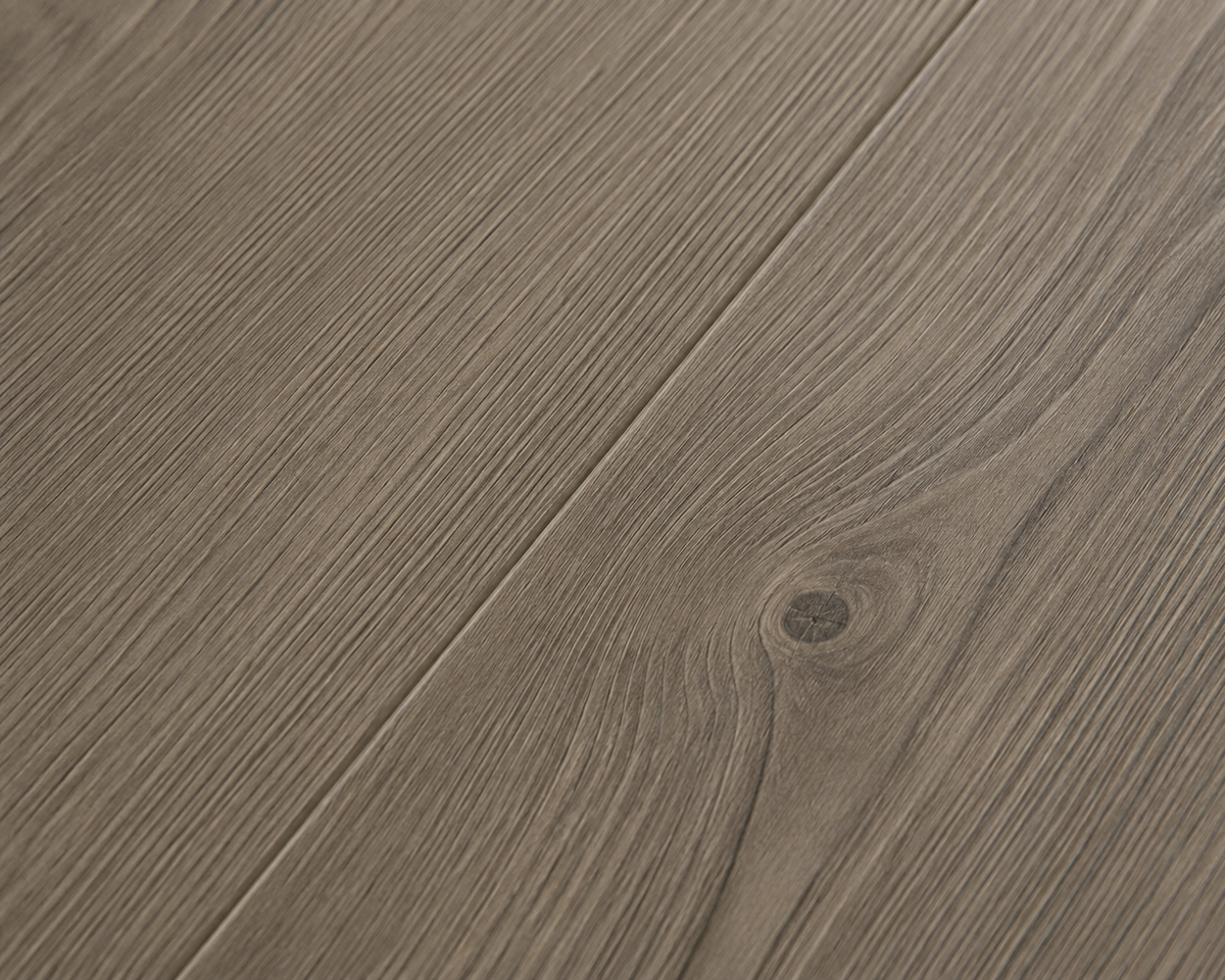 Close-up of Monaco Oak SPC flooring with fine linear grain and a subtle knot