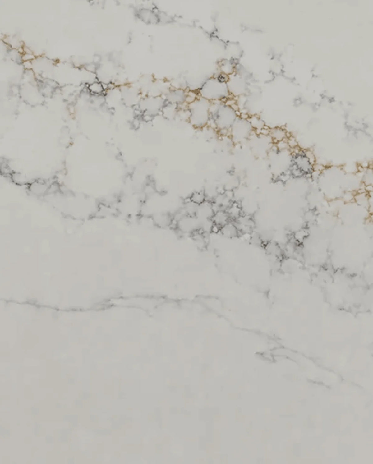 Calacatta Bellagio Quartz surface with a white background and dramatic gray and warm gold veining