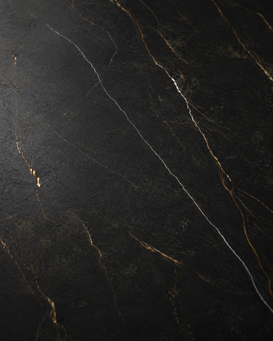 Close-up of Stratum Portoro F1 in Polished finish with copper-gold and silver-gray veining on a black field