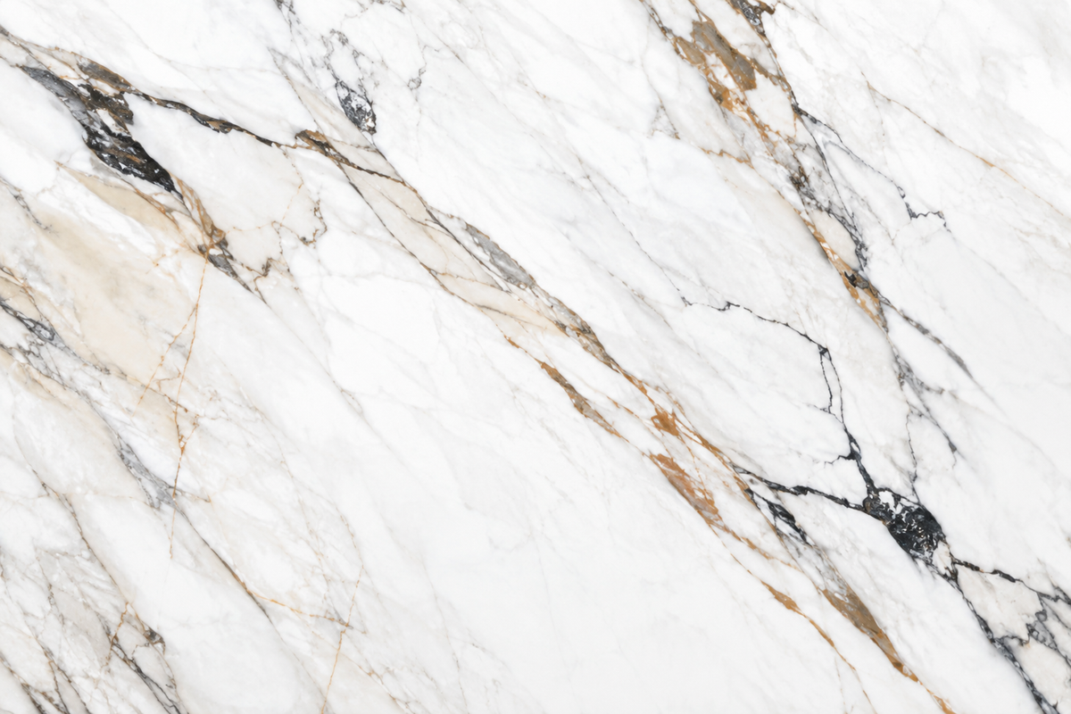 Close-up of Calacatta Luxe porcelain Face A with fractured charcoal and warm bronze veining