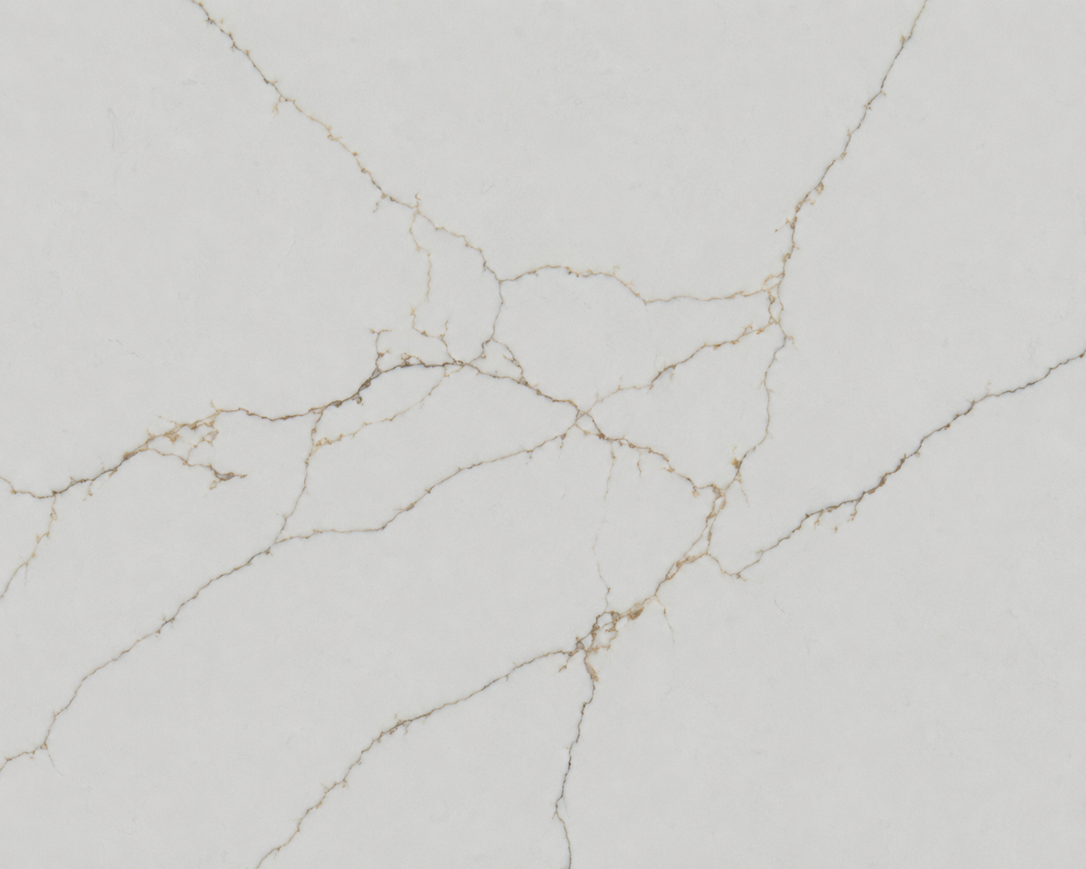 Close-up of white stone surface with fine warm gold veining