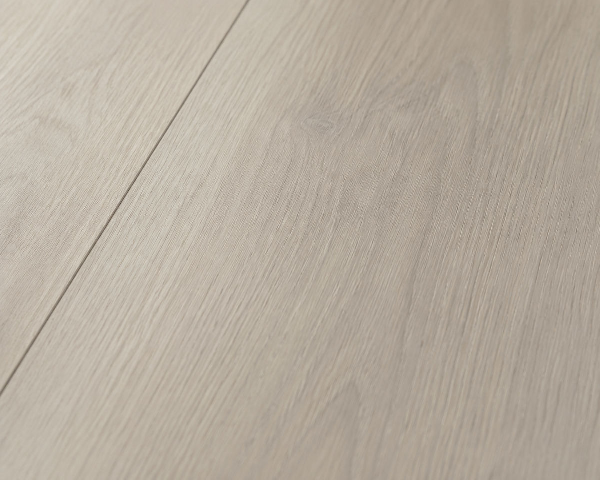 Close-up of Golden Maple SPC flooring showing fine natural wood grain and subtle texture