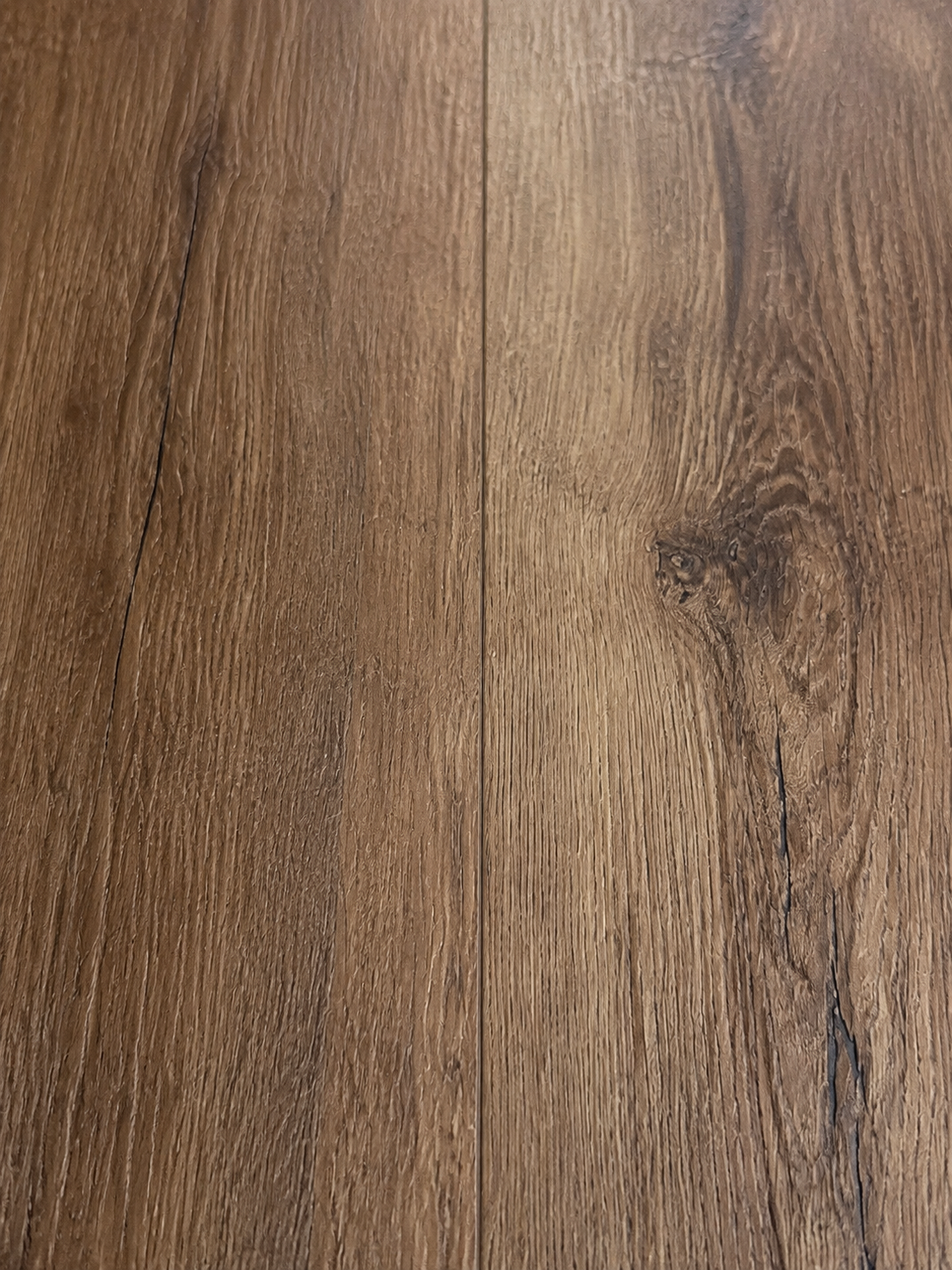 Silver Ridge SPC flooring close-up showing natural oak grain and micro-beveled joint